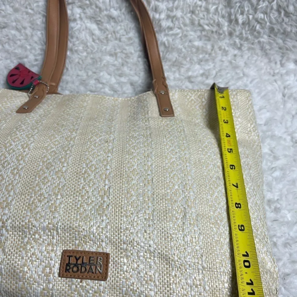 Tyler Rodman beige woven large tote with tan faux leather trim and straps .